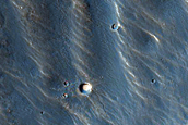Small Channels in Claritas Fossae