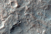 Curved Channels in Claritas Rupes