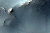 Prehnite and Phyllosilicate-Rich Terrain in Flaugergues Crater Rim