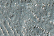 Southern Mid-Latitude Crater with Fill in Claritas Fossae