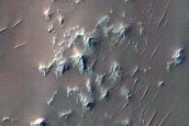 Channels and Features near Deepest Point of Holden Crater