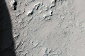 Crater Overtopped by Flows in Terra Sirenum