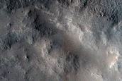 Small Lobe of Glacial Cover on Fresh Impact Crater