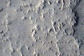 Partial Icy Fill of Impact Crater onto Graben