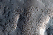 Small Lobe of Glacial Cover on Fresh Impact Crater