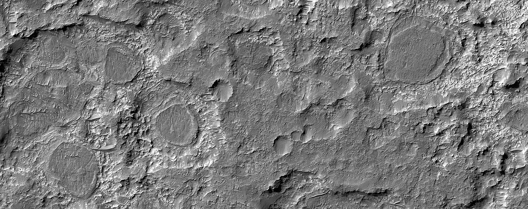 Dark Patches Formed by Craters