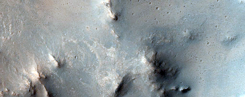 Impact Crater Exposing Bedrock