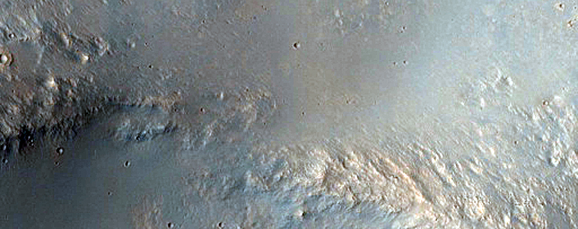 Fresh Cratering Covering Crater Rim