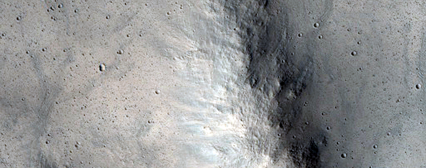 Relatively Fresh Crater with Central Pit and Layered Ejecta