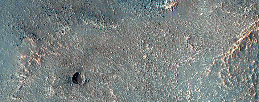 Flow Feature on Crater Rim in Bosporos Planum