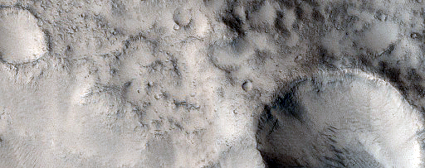 Channel Entering Old Northern Mid-Latitude Crater