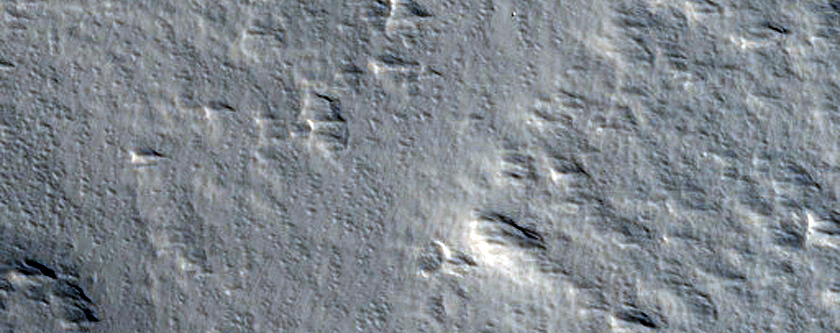 Impact-Related Deposits and Flows Northeast of Ascraeus Mons