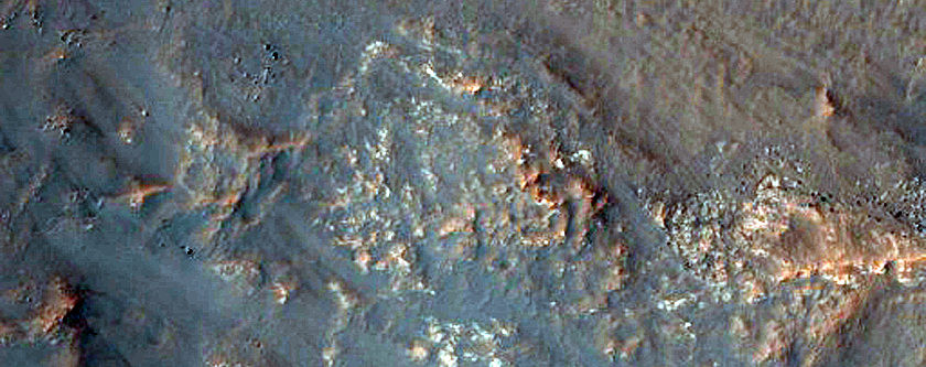 Source of Stratified Fan Material in Southeast Baltisk Crater