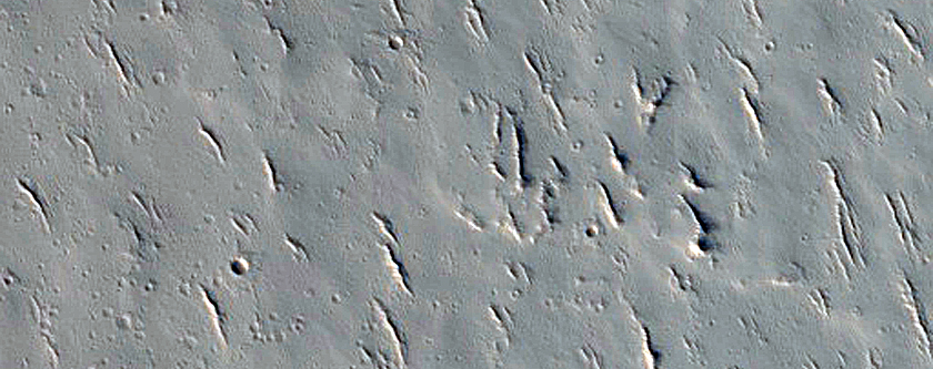 Chain of Pits Between Ceraunius Fossae and Ascraeus Mons