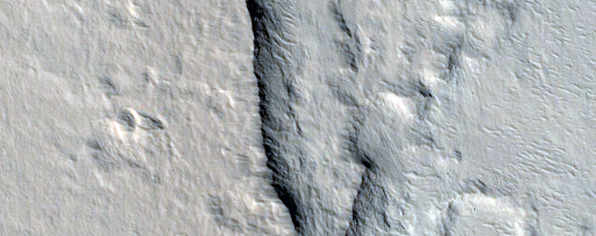 Impact-Related Deposits and Flows Northeast of Ascraeus Mons
