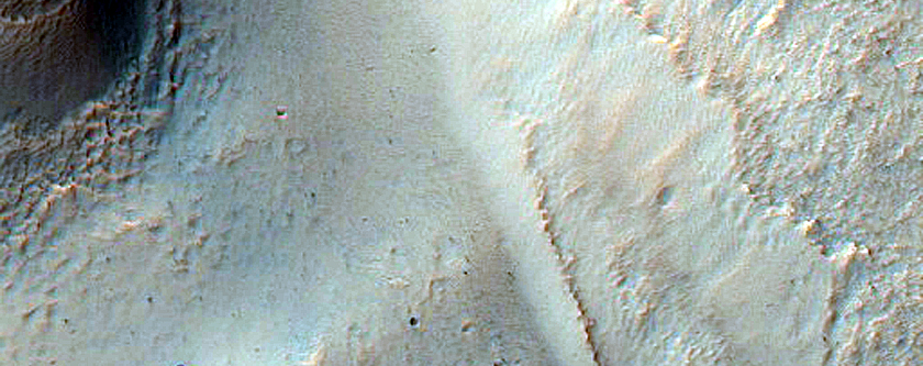 Gully Associated Light-Toned Materials in Crater in Terra Cimmeria