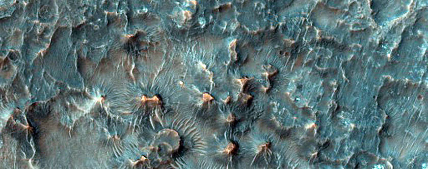 Small Sinuous Ridges and Butte-Forming Material in Crater