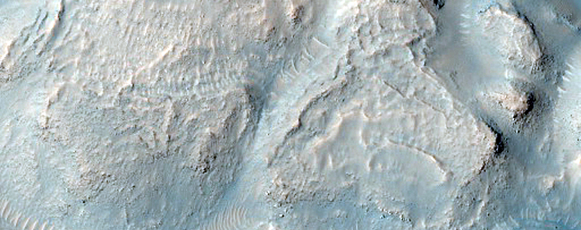 Interaction between Sirenum Fossae and Gorgonum Chaos