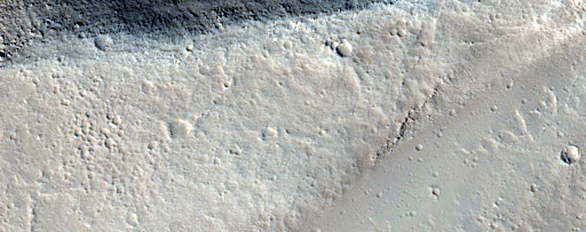 Fossae Intersecting Wrinkle Ridge East of Olympus Mons