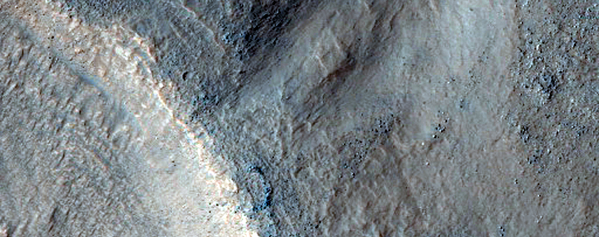 Dipping Layers in Crater in Centauri Montes