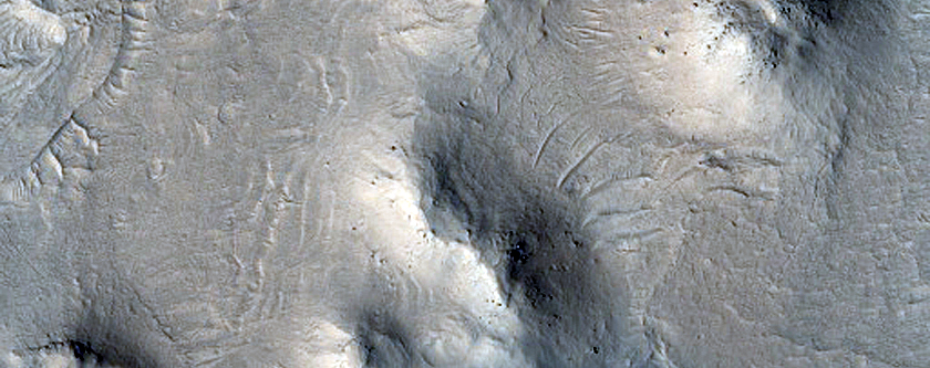 Dark-Toned Material in Depressions in Buttes and Plains in Aeolis Region