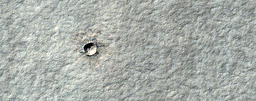 Monitoring New Small South Polar Layered Deposits Crater