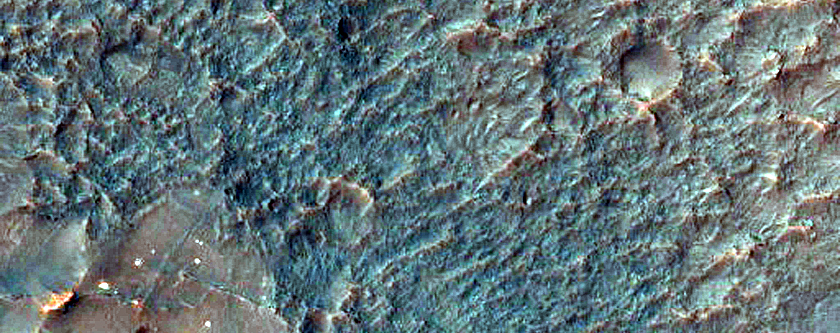 Bright Patches on Degraded Crater Floor in Thaumasia Planum