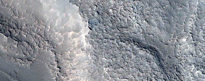 Curved Channels in Moreux Crater