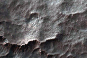 Scalloped Depressions and Seasonal Frost