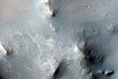 Impact Crater Exposing Bedrock