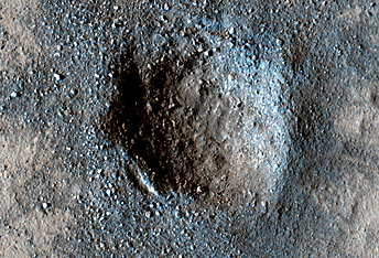 Slow Changes at an Old Impact Crater