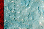 Diverse Exposures of Bedrock Associated with Hellas Planitia Massifs