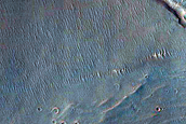 Pole-Facing Gullies in 7-Kilometer Crater within Bond Crater