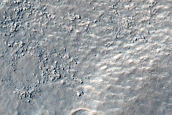 Scalloped Depressions and Mantling Material