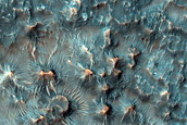 Small Sinuous Ridges and Butte-Forming Material in Crater