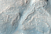 Interaction between Sirenum Fossae and Gorgonum Chaos
