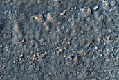 Crater with Concentric Crater Fill in Claritas Fossae