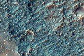 Bright Patches on Degraded Crater Floor in Thaumasia Planum