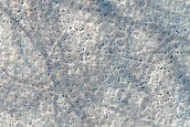 Crater with Ridge and Mantled Terrain in Terra Sirenum