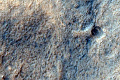 Layered Deposits in Small Crater in Terra Cimmeria 