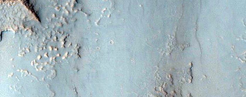 Gullies and Dark Material in Syrtis Major Planum Crater