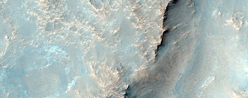 Diverse Exposures of Bedrock Associated with Circum-Hellas Planitia Massifs