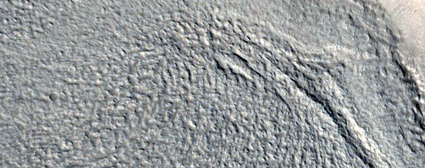 Crater with Mesa in Enipeus Vallis