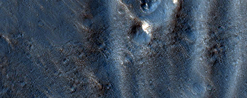 Channel Networks in Claritas Fossae