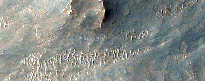 Possible Melt Flows from Oudemans Crater