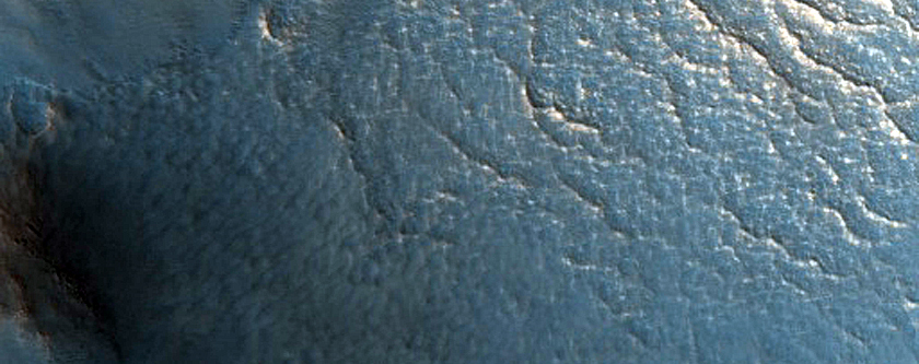 Mid-Latitude Crater with Gullied Central Structure and South-Facing Slopes