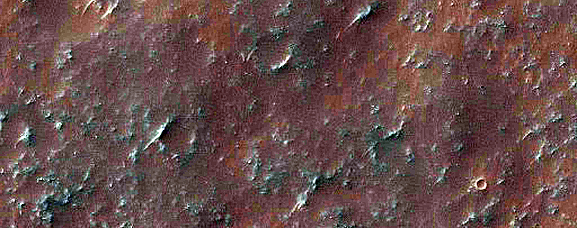 Possible Olivine-Bearing Materials along Sirenum Fossae in Gorgonum Chaos