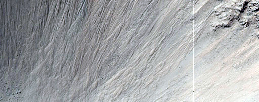 Crater with Rock Exposures and Steep Slopes