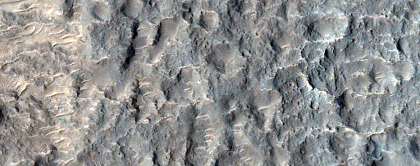 Channel Cutting Crater Rim in Tyrrhena Terra
