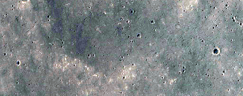 Pasted-on Material on Crater Ejecta